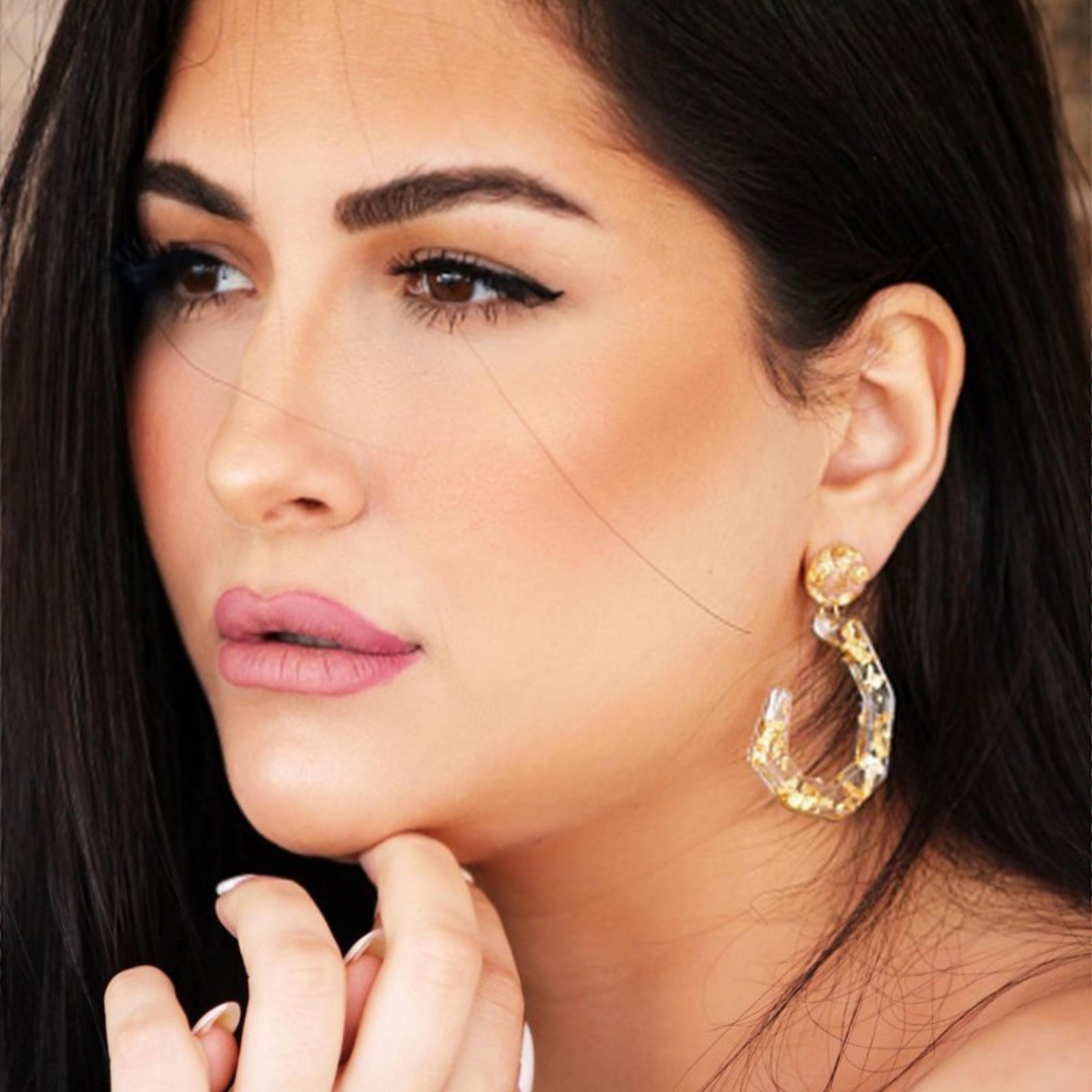 THE CLEAR GOLD-FLAKE RESIN EARRINGS .