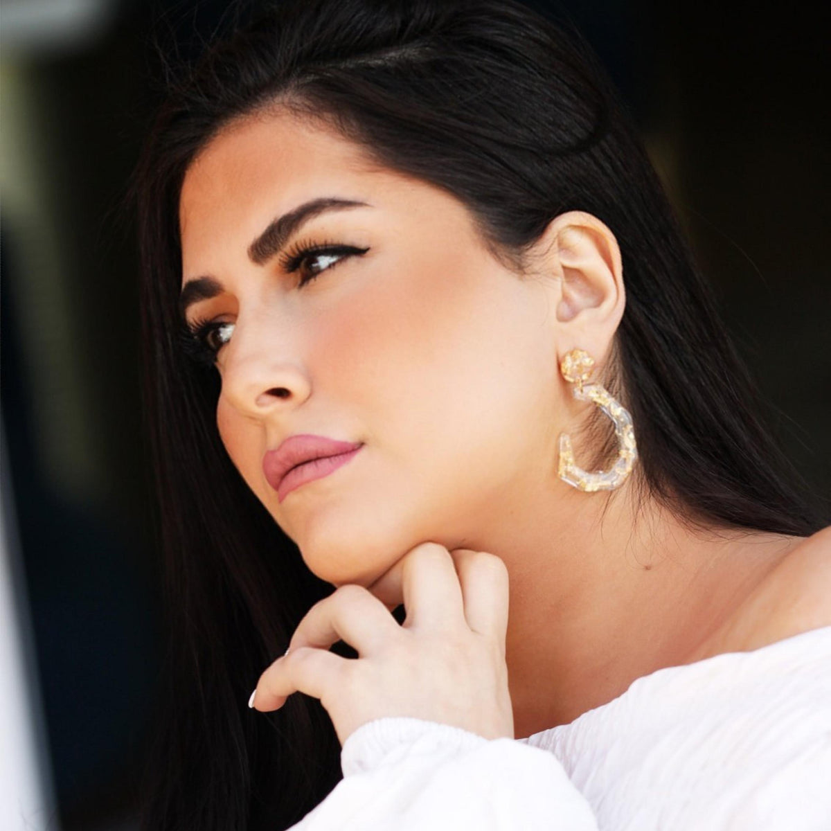 THE CLEAR GOLD-FLAKE RESIN EARRINGS .